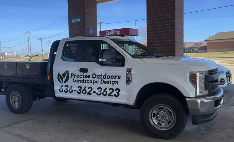 Precise Outdoors and Design truck conducing sod install.