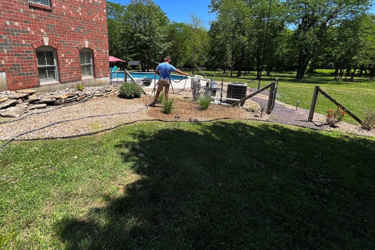 Precise Outdoors and Design installing sod.