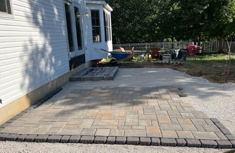 Installation in progress of a paver patio in St. Charles County.
