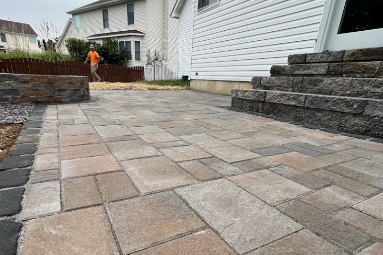 Paver Patio with a member of our team installing it in St. Charles, Missouri.