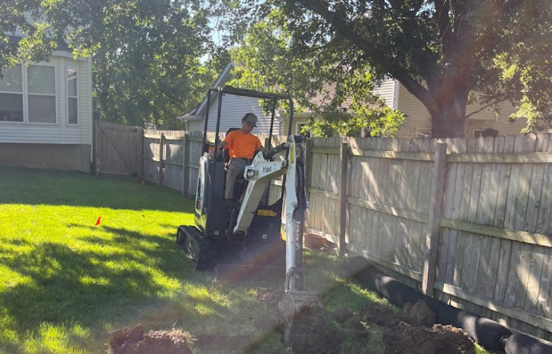 Team member in the process of installing sod in St. Charles County.